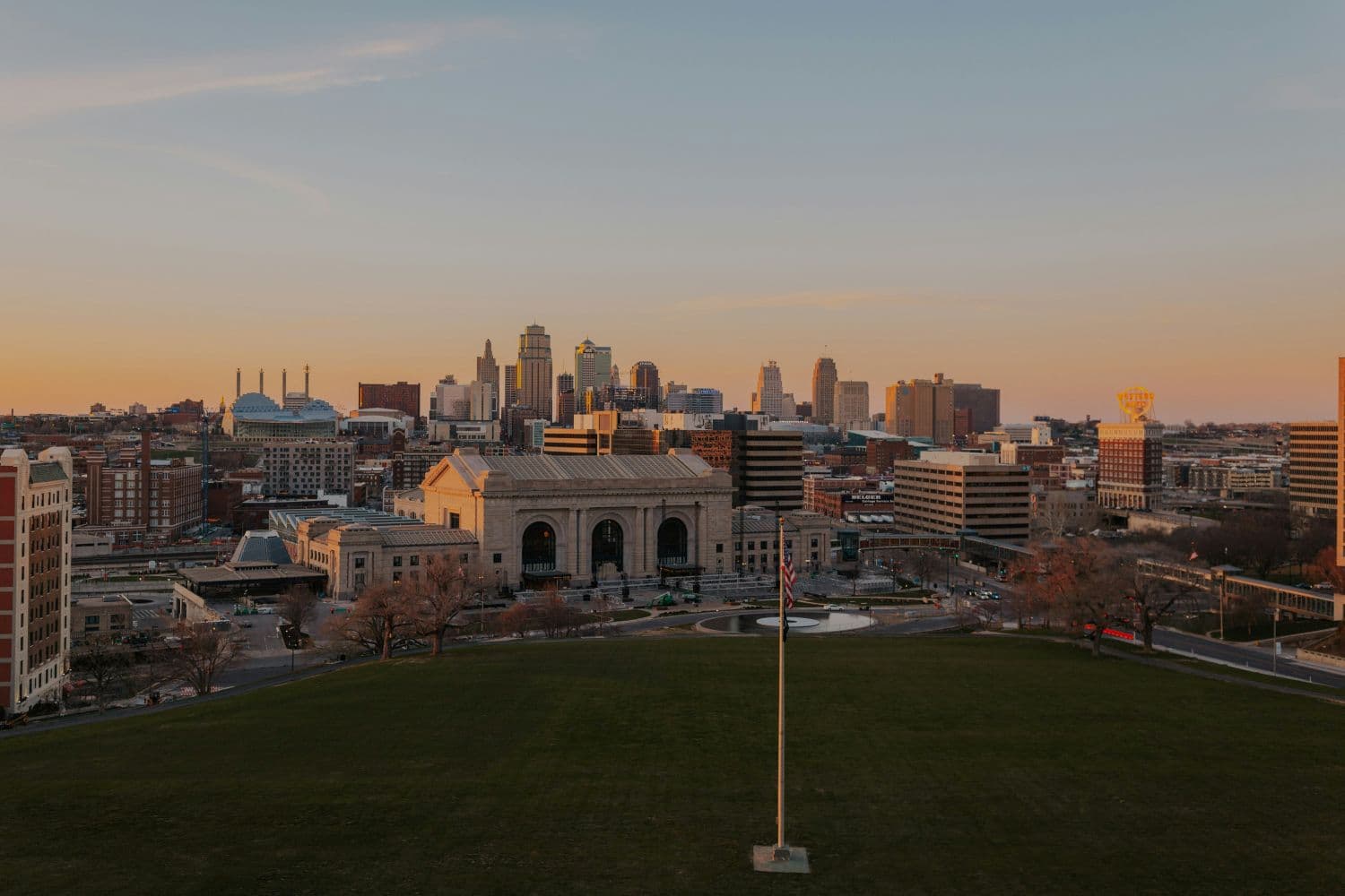 View of the Kansas City skyline and Union Station at sunset.